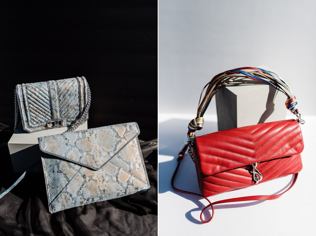 A bright red purse and a blue snakeskin purse/clutch combo on a black background.