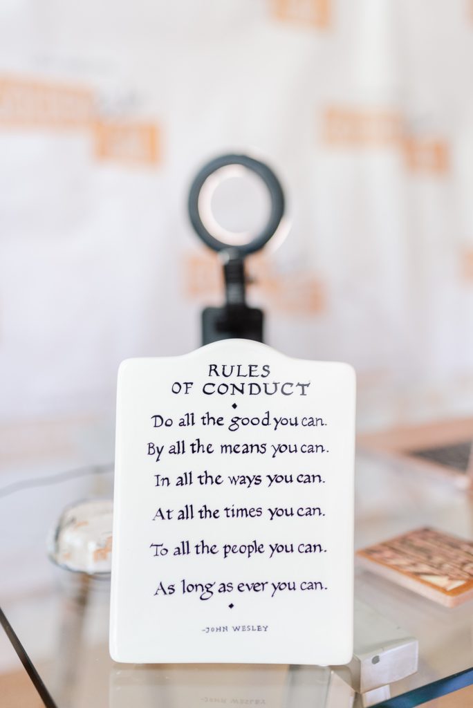 rules of conduct written on a white stone tablet decor. the rules are: Do all the good you can, By all the means you can, In all the ways you can, At all the times you can, To all the people you can, As long as ever you can.