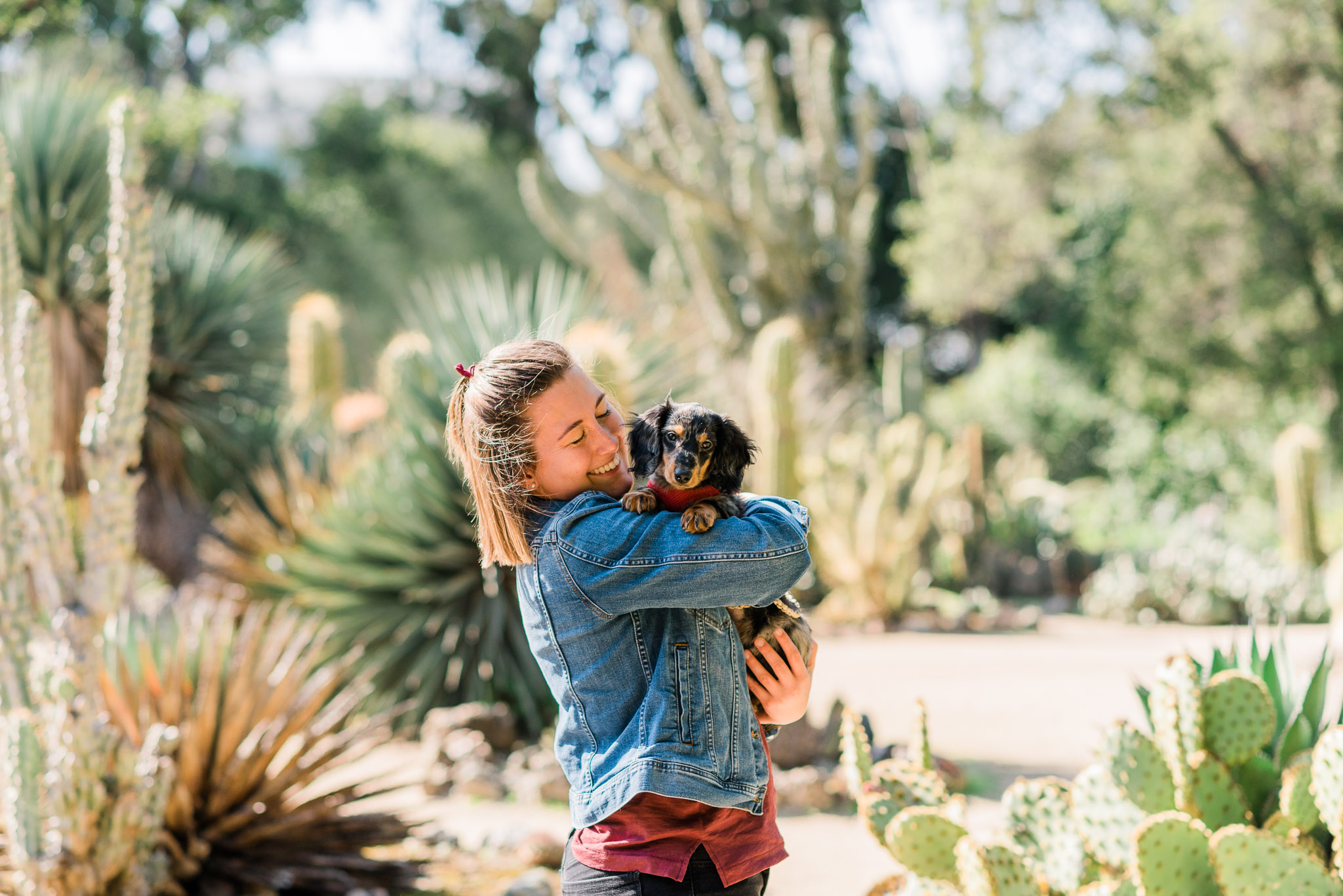 Woman holding her Dachshund