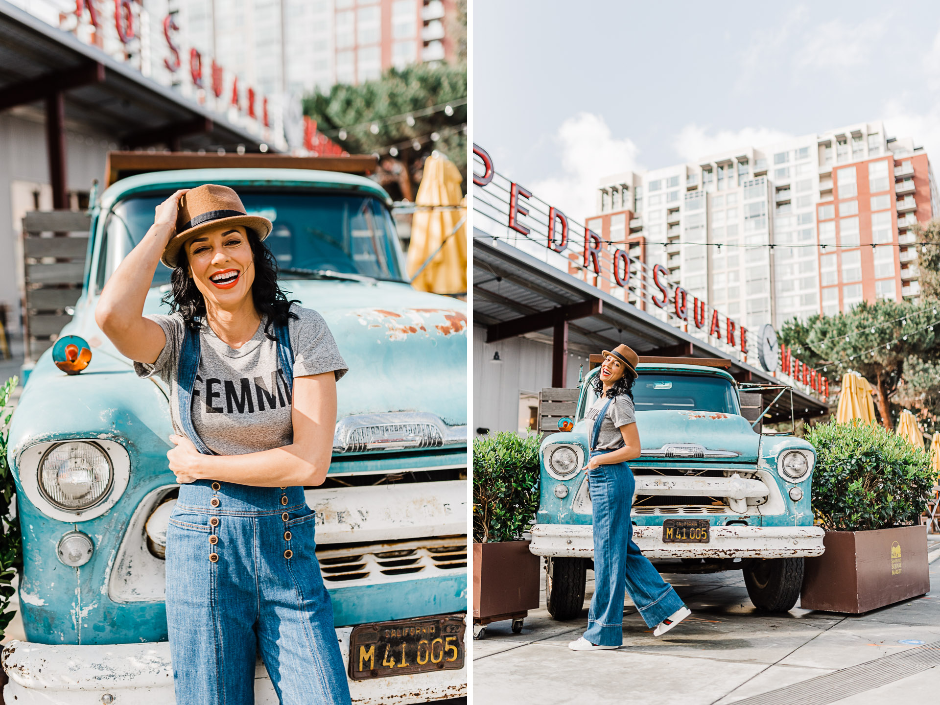 Woman wearing grey "femme" shirt wearing overalls, standing in front of a blue decorative truck at the San Pedro Square Market.