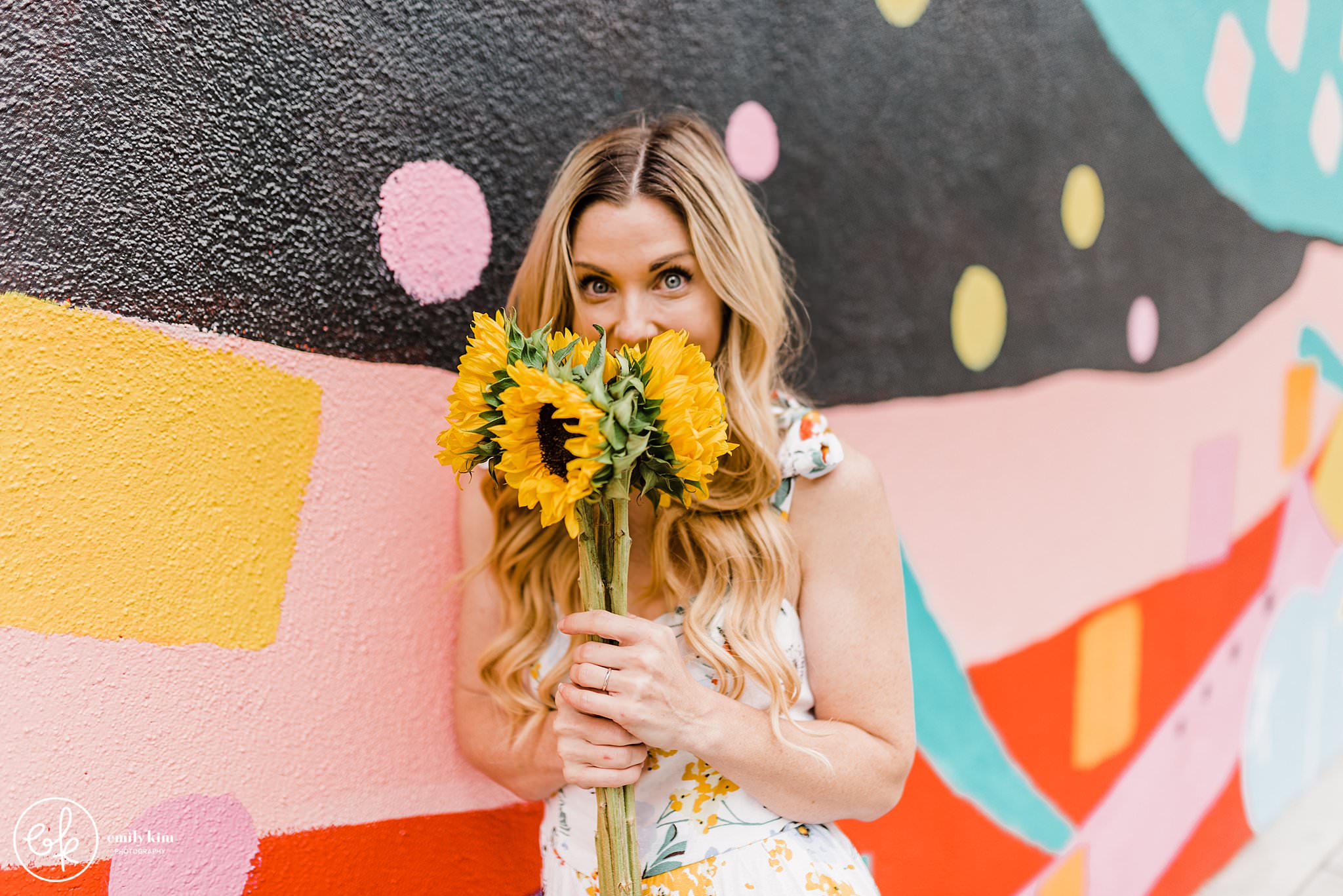 Use sunflowers or a bouquet as props during your photoshoot.