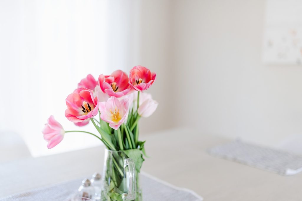 pink flowers in a clear glass vase