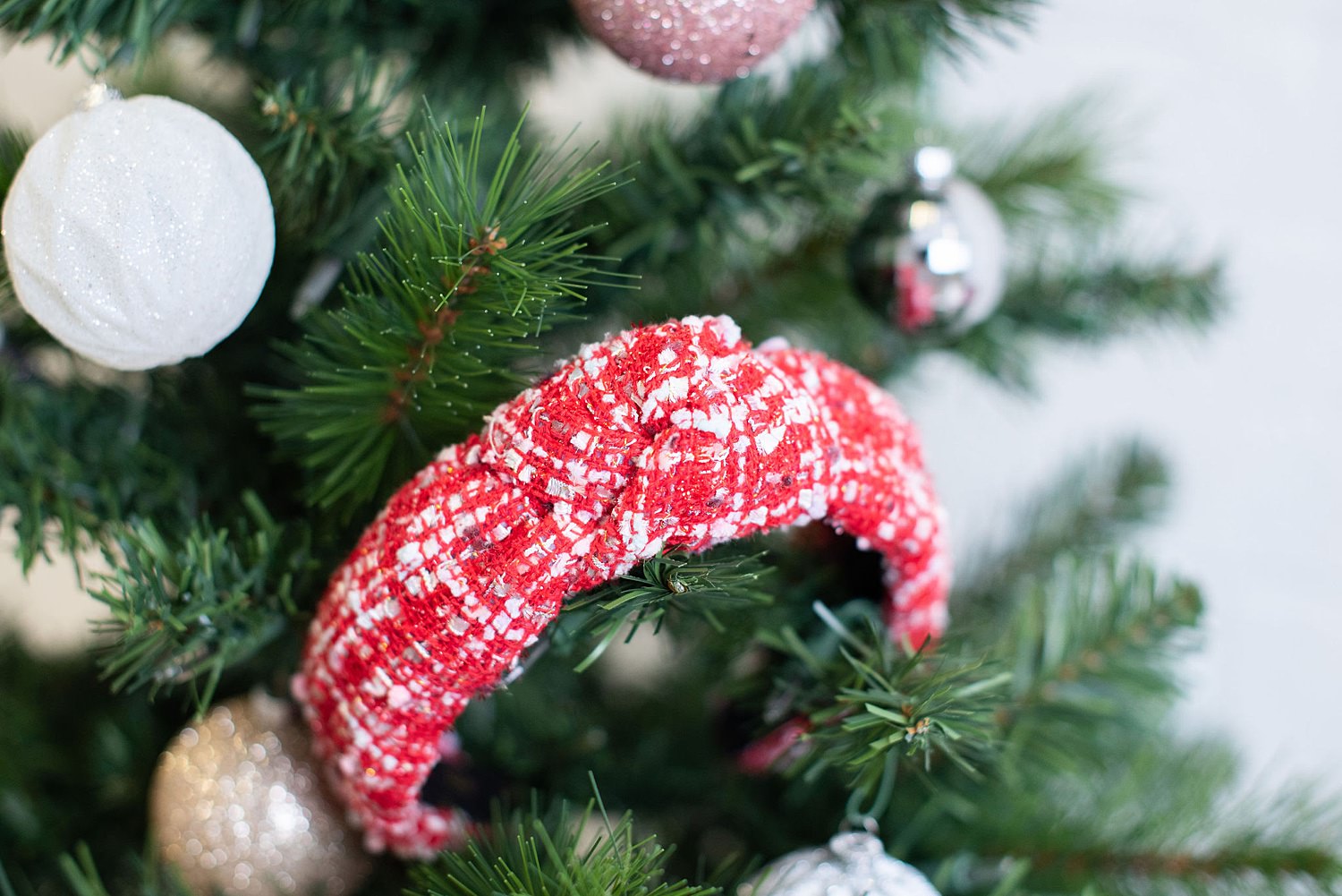 A red headband on the Christmas tree.