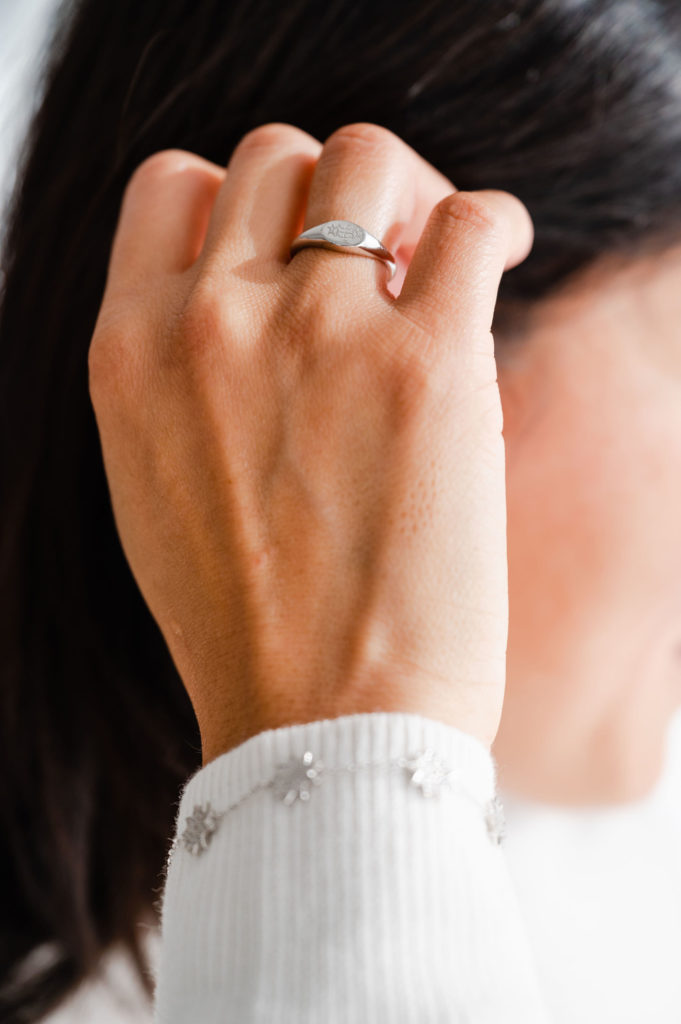 woman wearing a silver Bahai ring