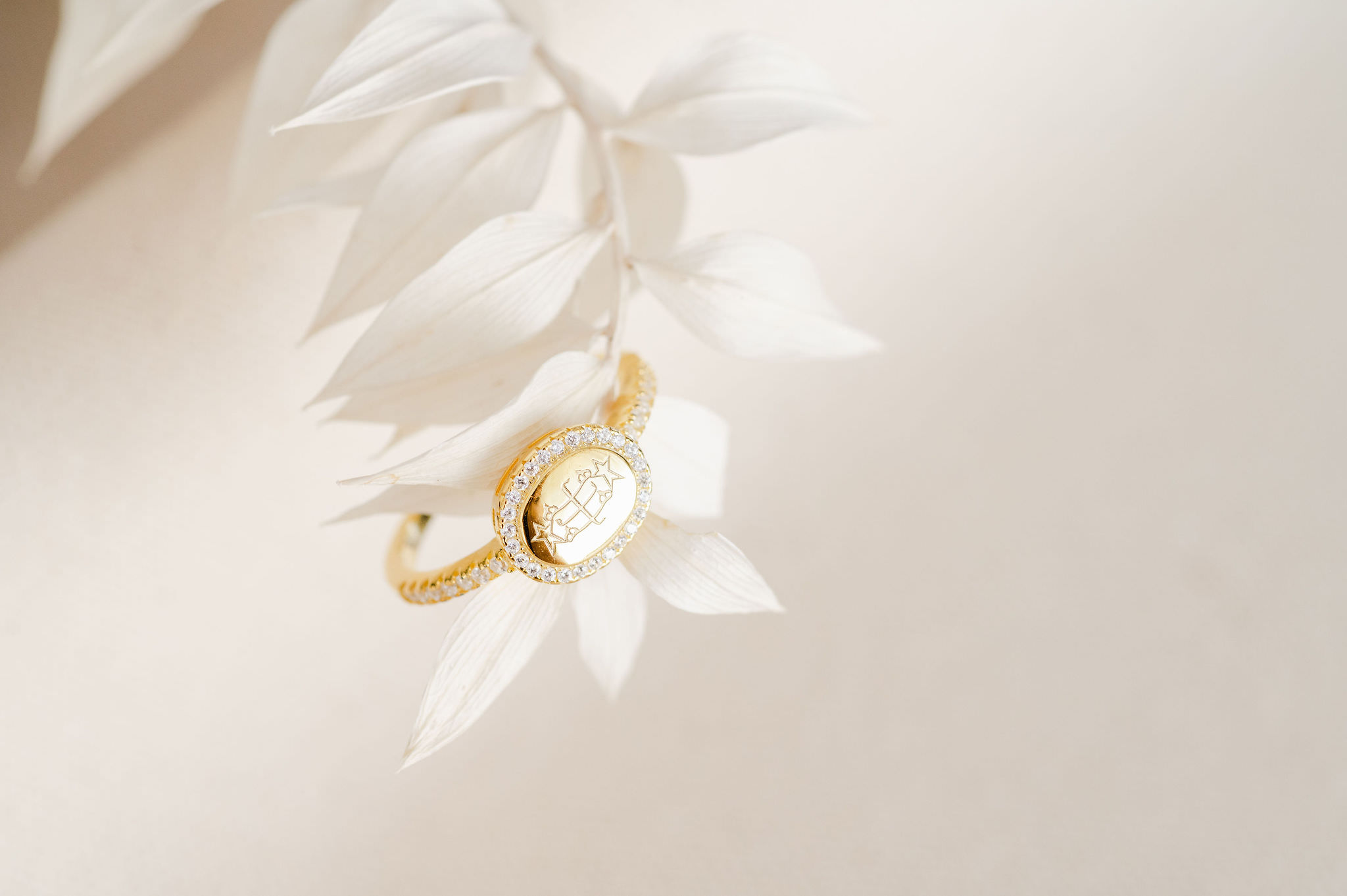 a Bahai ring on a white floral stem.
