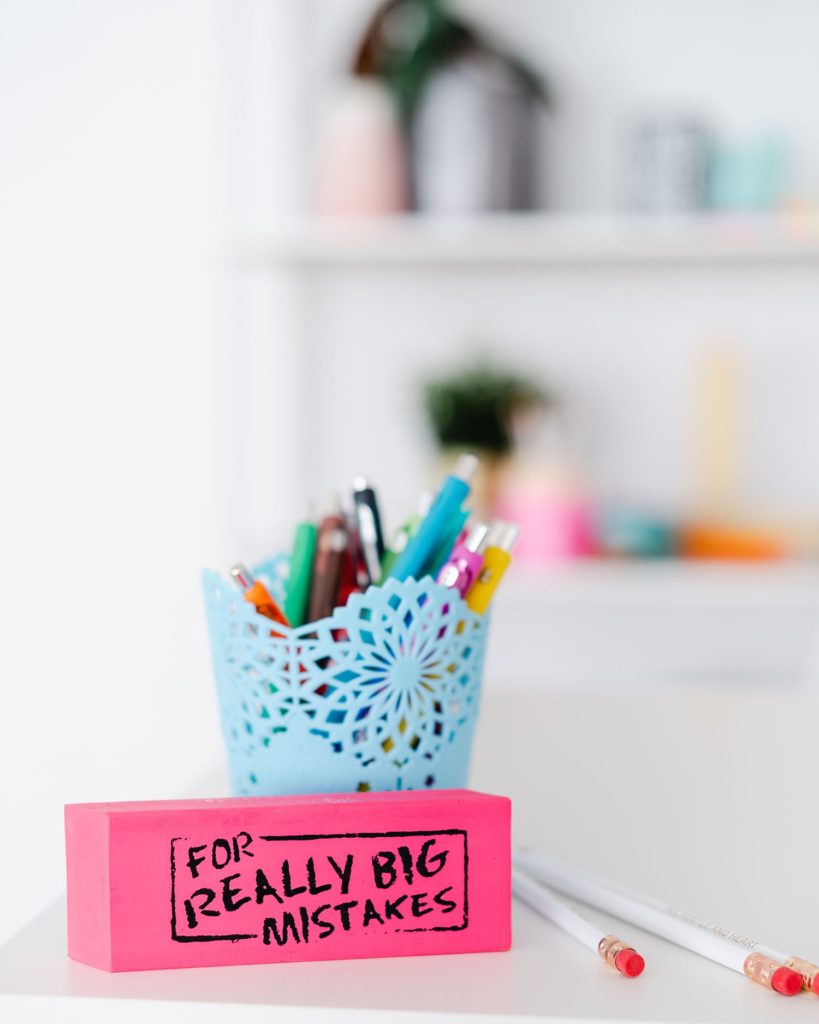 Blue Cup of Pens with Pink Post-it and Note
