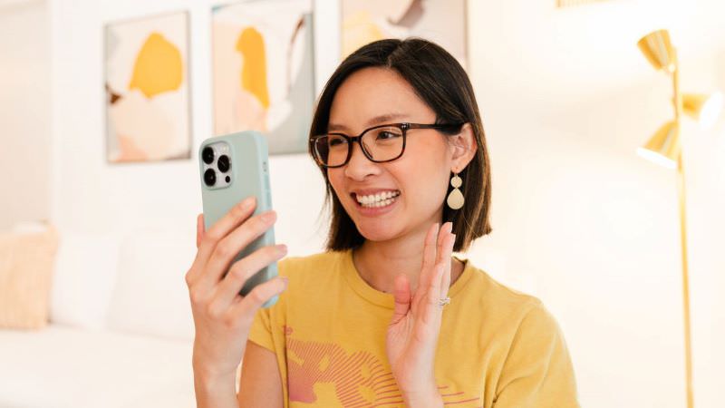brand photographer doing social media marketing with her phone