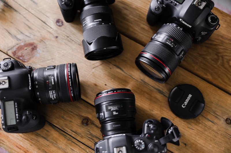 4 cameras laying on a table