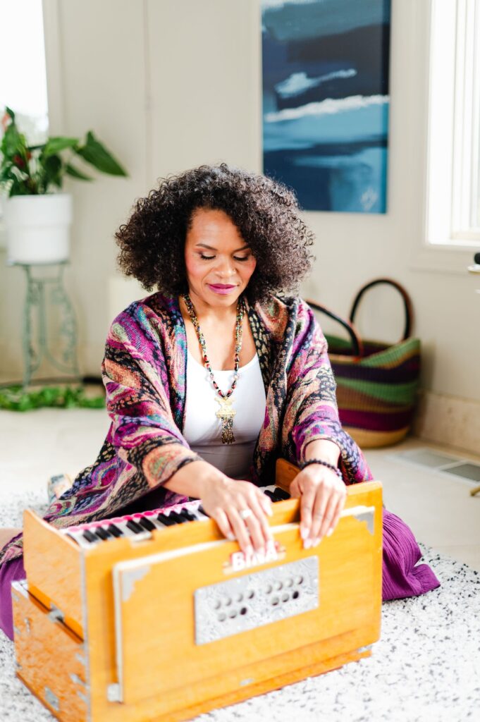 woman playing the harmonium