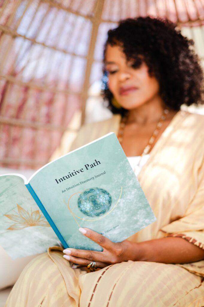 close up of Tiffany Jeans holding her book, the Intuitive Path